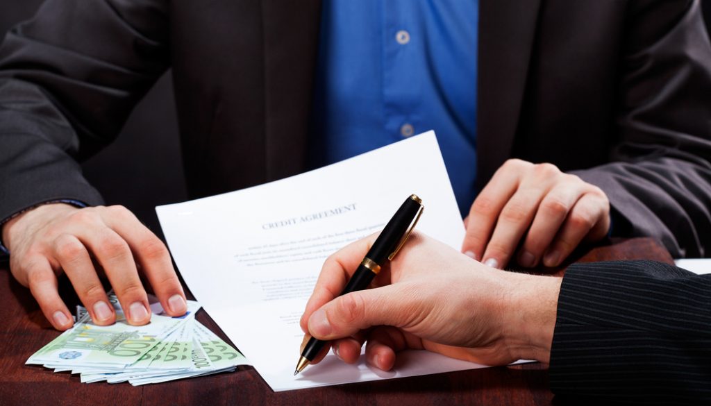 A,Closeup,Of,A,Man,Signing,An,Express,Cash,Loan