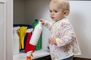 Toddler,Playing,With,Household,Cleaners,At,Home