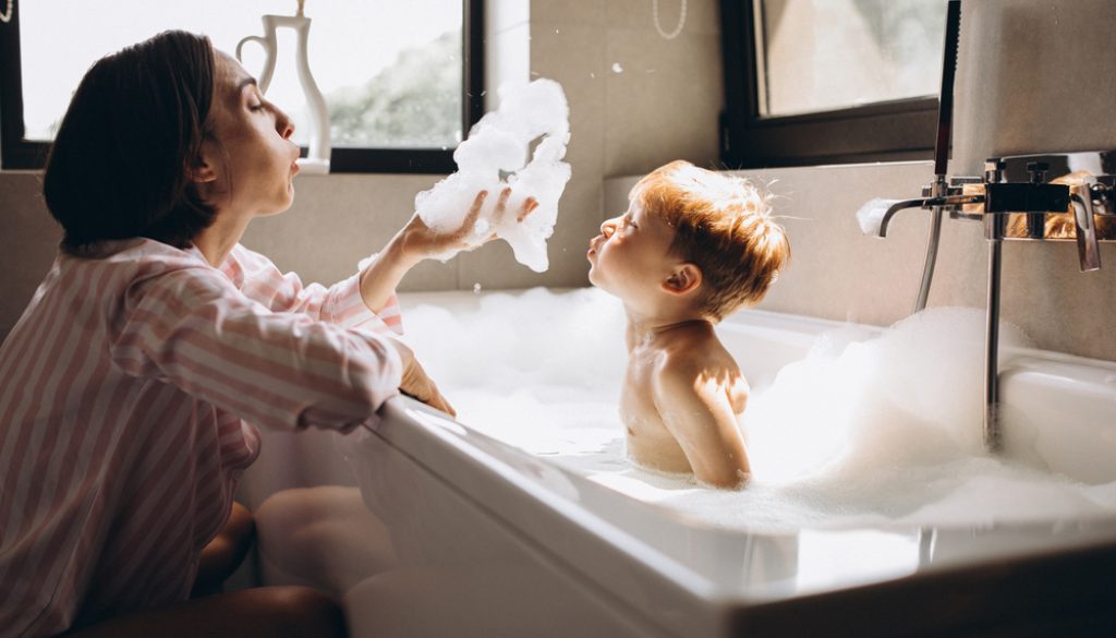 Mother,Washing,Little,Son,In,Bathroom