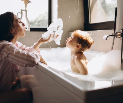 Mother,Washing,Little,Son,In,Bathroom